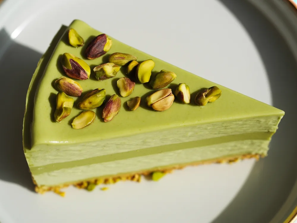 AI illustration of matcha pistachio cheesecake